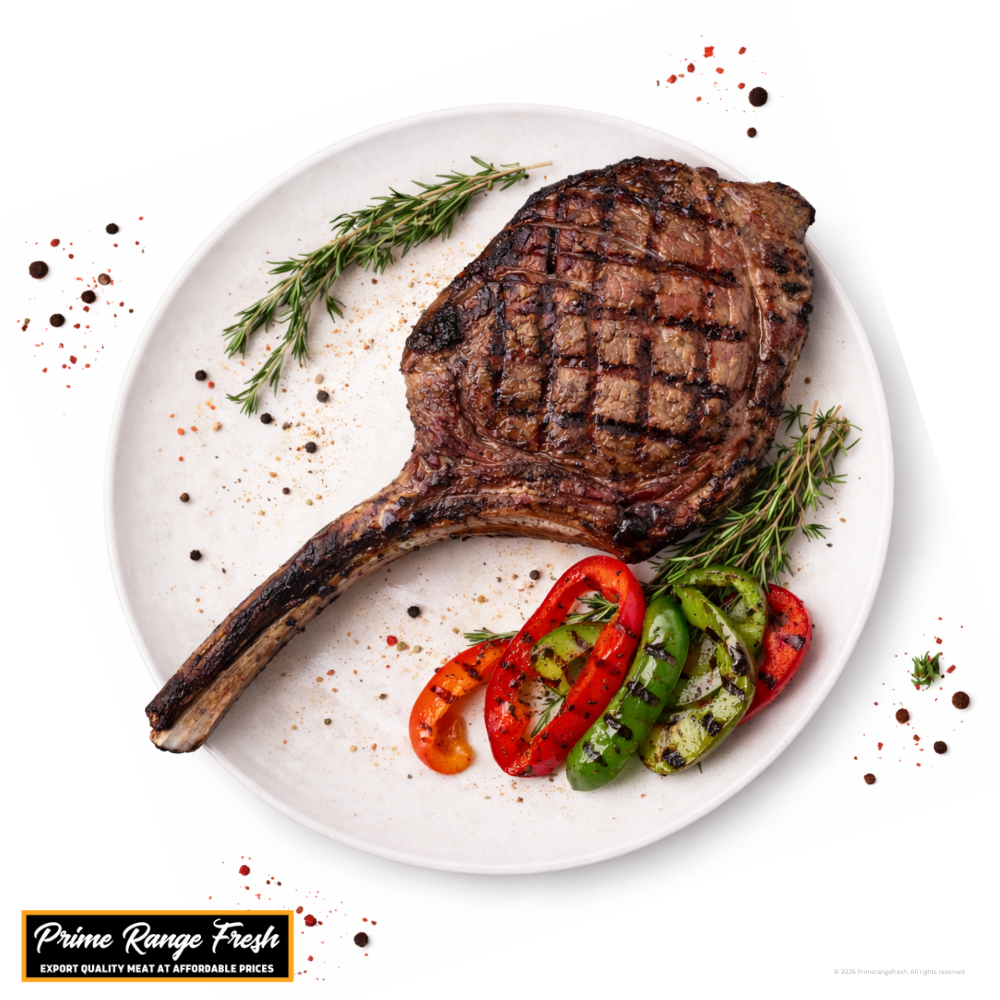 Grilled Tomahawk Steak with vegetables on a white plate, featuring Prime Range Fresh branding.