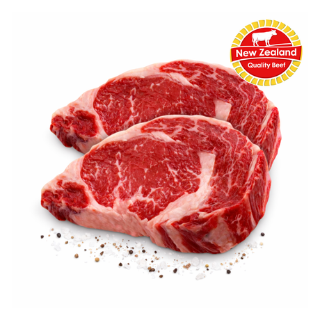Two raw beef steaks with New Zealand Quality Beef logo on a white background